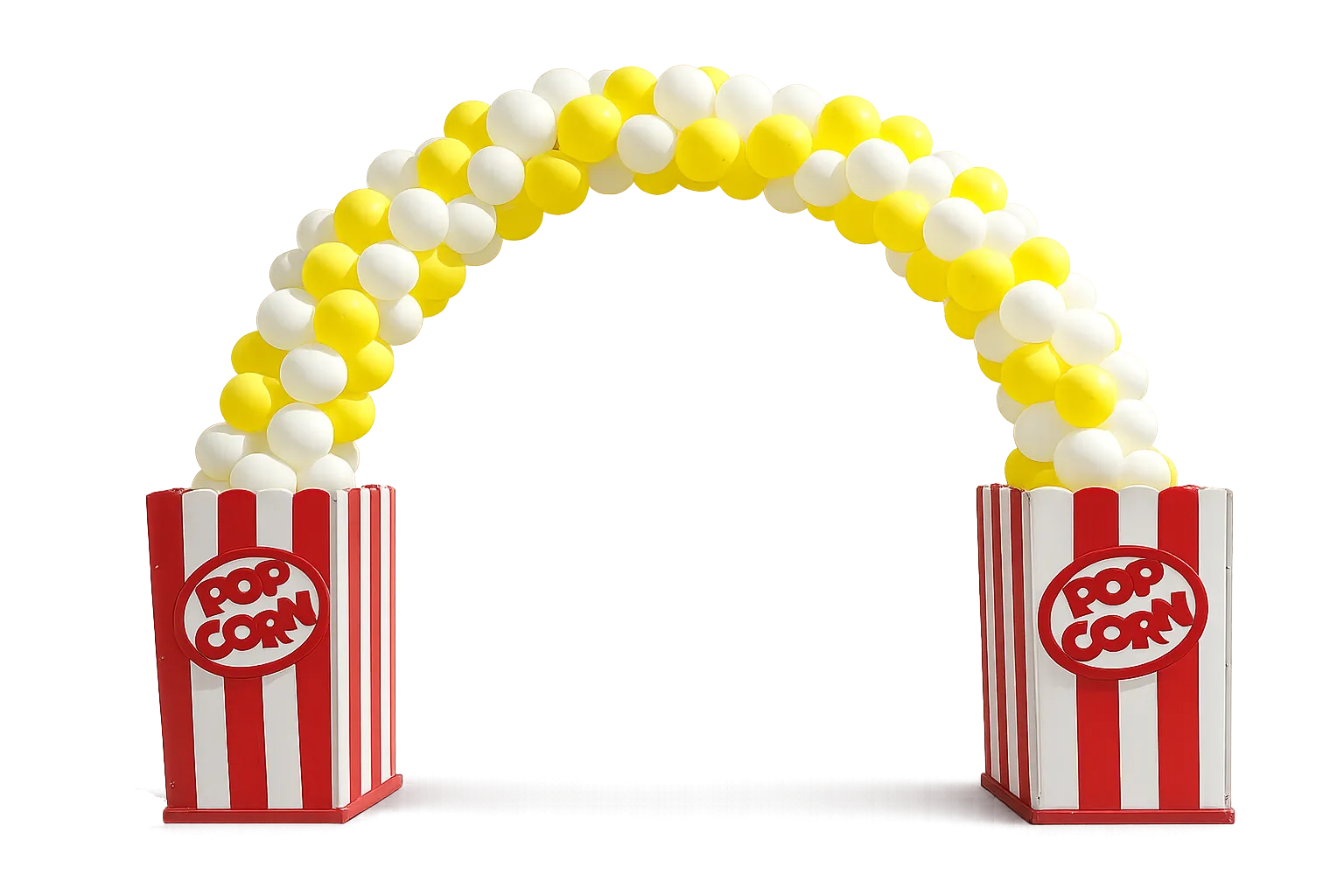 A themed photo backdrop with coordinated props and a balloon column at one corner of a backyard carnival event