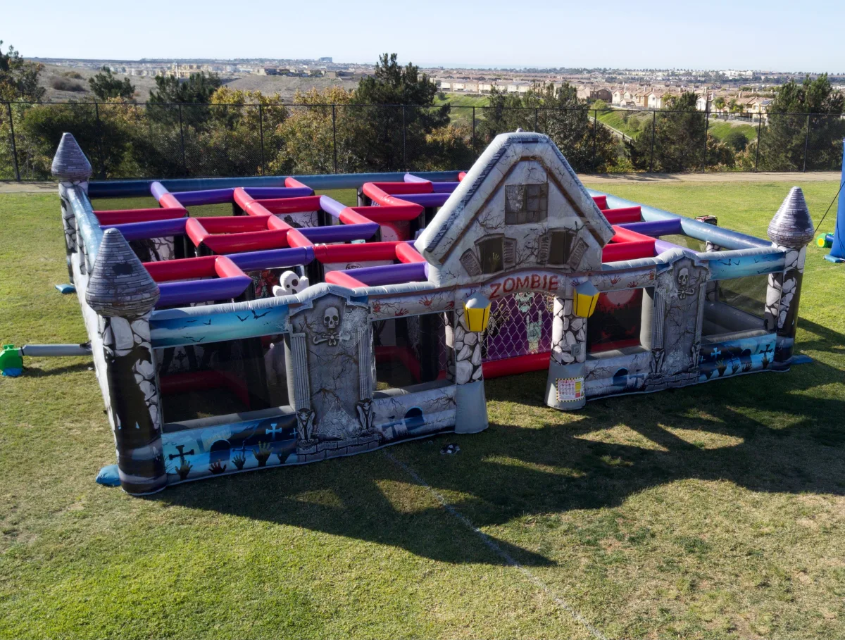 Aerial view of the inflatable Zombie Maze walk-through attraction on a grass field